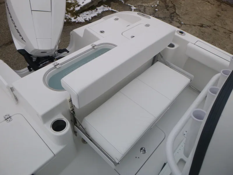 Slide: The Image of 2024 Sea Pro 222 Center Console boat with white seating and engine. - 10