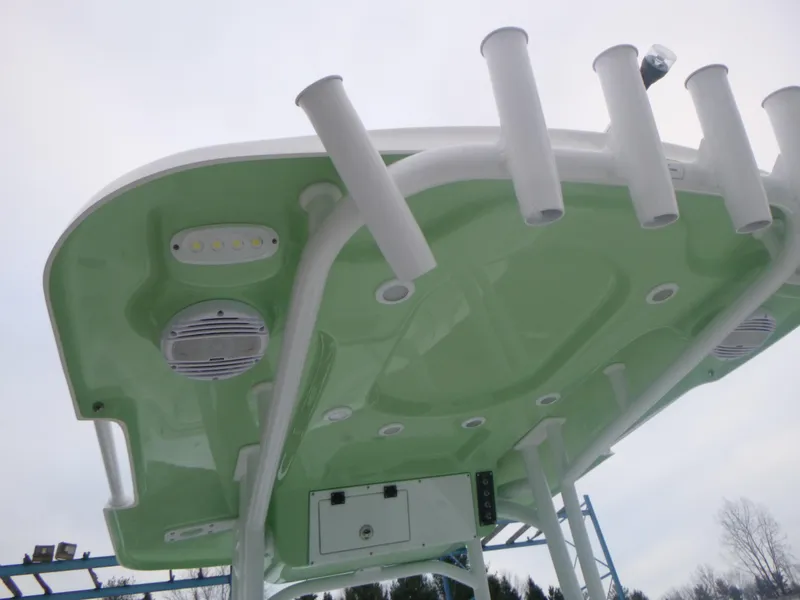 Slide: The Image of 2024 Sea Pro 222 Center Console T-top with rod holders and speakers. - 17