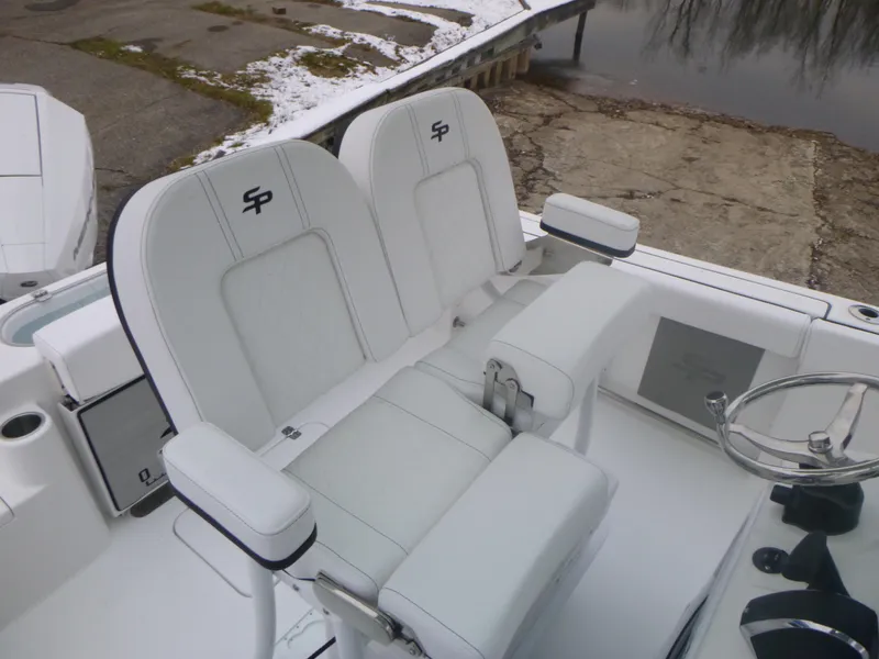Slide: The Image of 2024 Sea Pro 222 Center Console boat with white cushioned seating. - 8