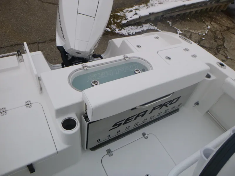 Slide: The Image of 2024 Sea Pro 222 Center Console boat with motor and storage compartments. - 9