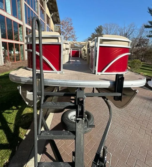 Slide: The Image of 2024 Sun Tracker Party Barge 22 XP3 pontoon boat on a trailer. - 2