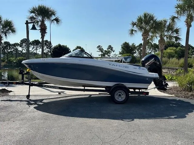 The Image of 2024 Tahoe 185 S boat on trailer, parked near palm trees. - 0