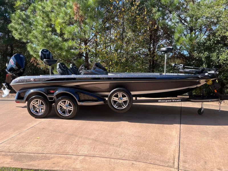Slide: The Image of 2024 Ranger Z521R Ranger Cup Equipped bass boat on a trailer. - 2