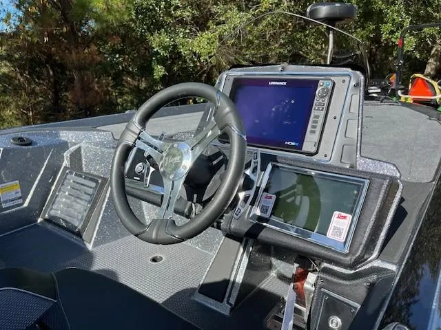 Slide: The Image of 2024 Ranger Z521R Ranger Cup Equipped boat dashboard with steering wheel and navigation system. - 5