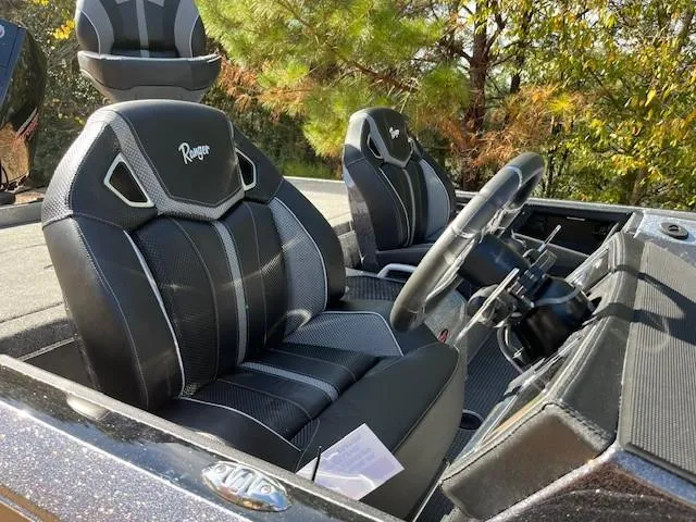 Slide: The Image of 2024 Ranger Z521R Ranger Cup Equipped boat interior with black and gray seats. - 6
