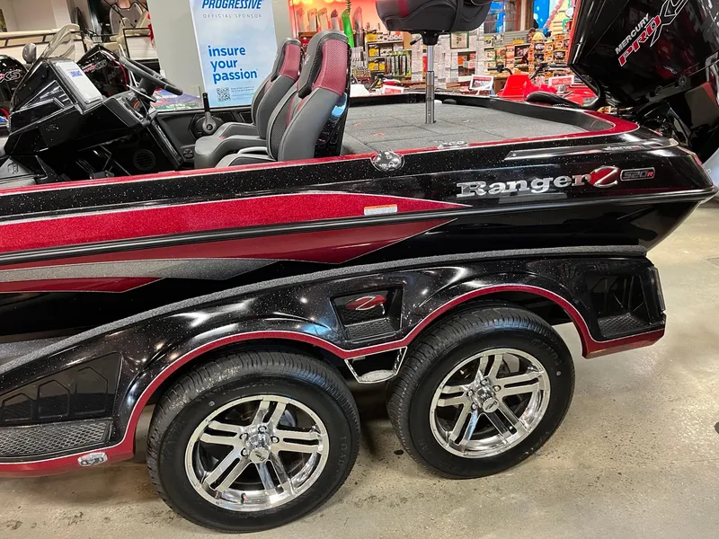 Slide: The Image of 2024 Ranger Z520R Ranger Cup Equipped boat with dual-axle trailer in showroom. - 1