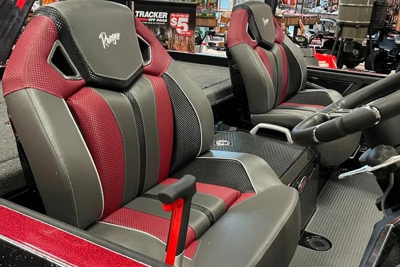 Slide: The Image of 2024 Ranger Z520R Ranger Cup Equipped boat interior with red and black seats. - 8
