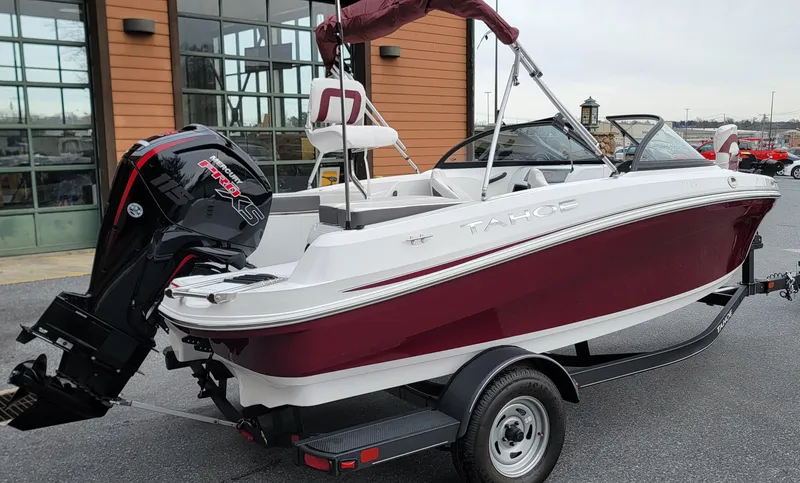 Slide: The Image of 2024 Tahoe 185 S boat with maroon and white design on a trailer. - 4
