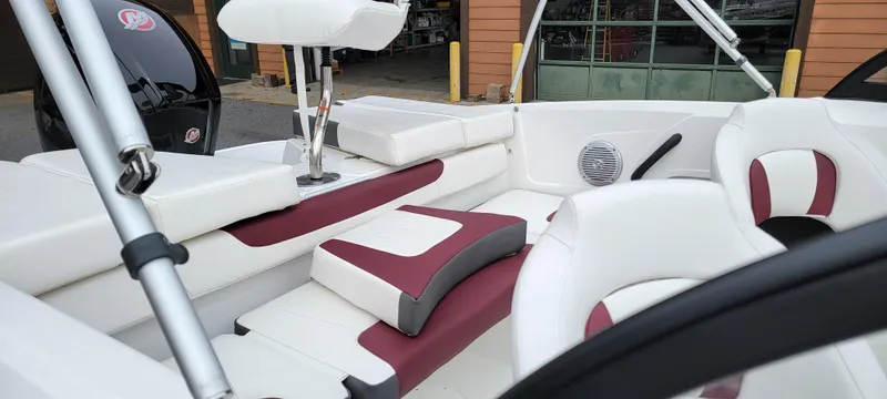 Slide: The Image of 2024 Tahoe 185 S boat interior with white and maroon seating, modern design. - 5