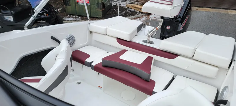 Slide: The Image of 2024 Tahoe 185 S boat interior with white and maroon seating. - 8