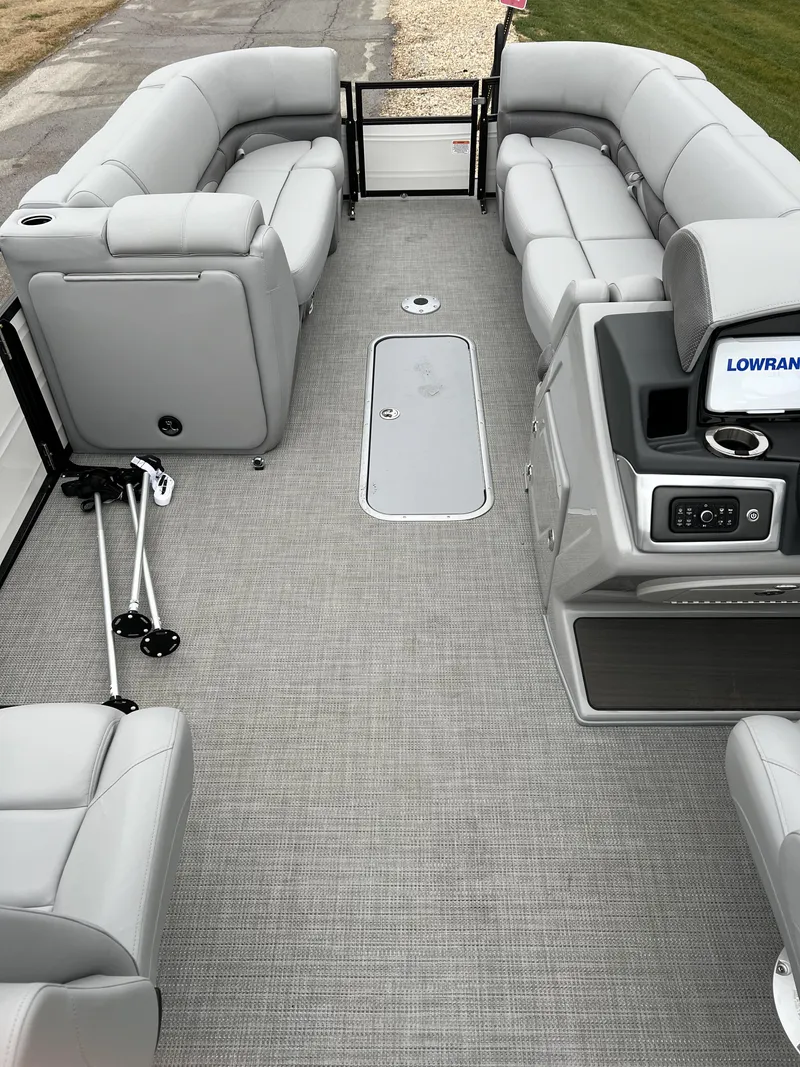 Slide: The Image of 2024 Regency 250 DL3 pontoon boat interior with plush seating and modern amenities. - 9