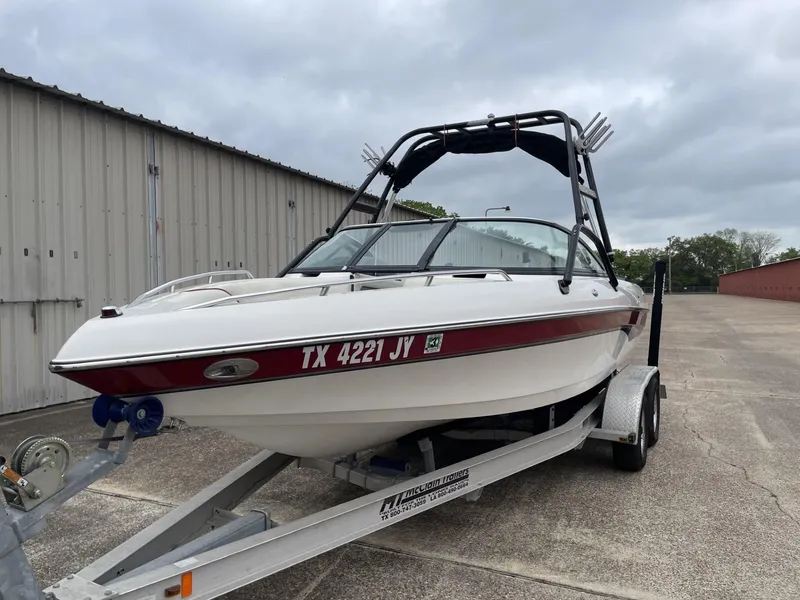 Slide: The Image of 2003 Malibu Sunscape 21 LSV boat on a trailer with registration TX 4221 JY. - 13