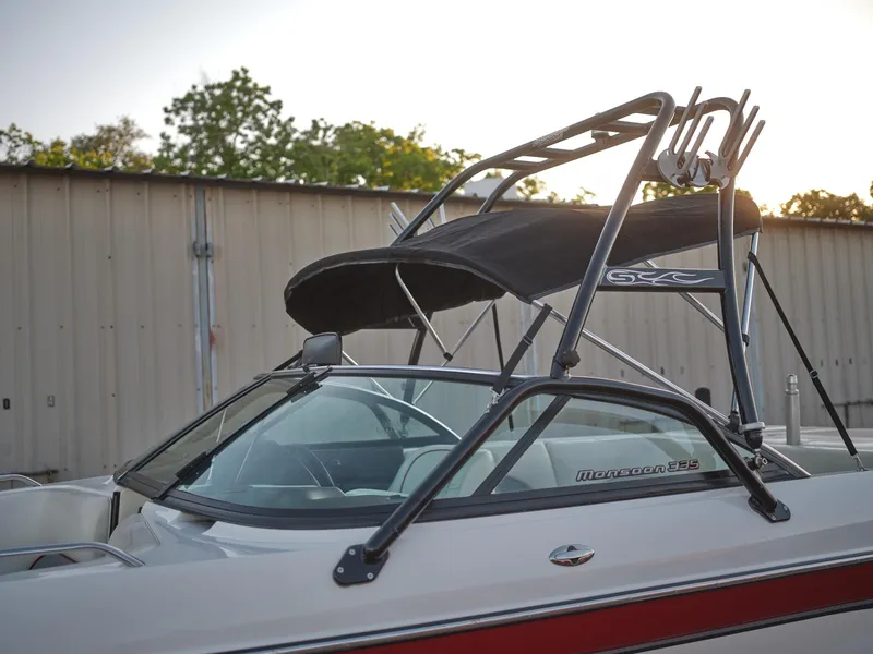 Slide: The Image of 2003 Malibu Sunscape 21 LSV boat with wakeboard tower and bimini top. - 14