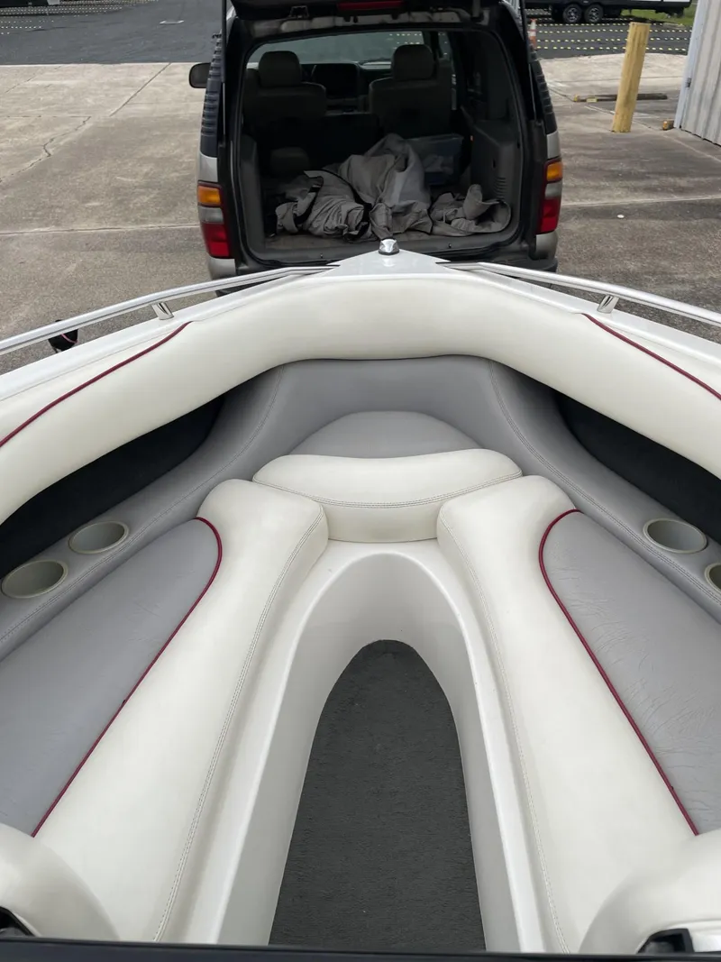 Slide: The Image of 2003 Malibu Sunscape 21 LSV boat interior with white and gray seating. - 20