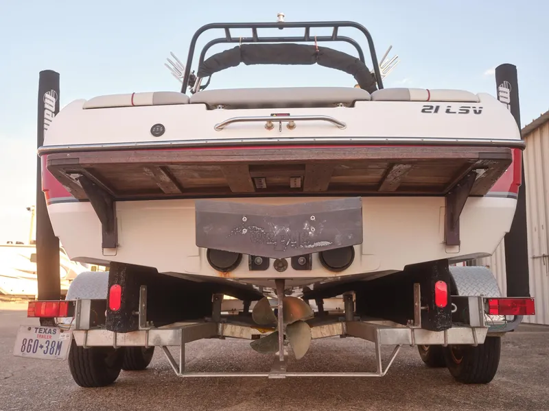Slide: The Image of 2003 Malibu Sunscape 21 LSV boat on trailer, rear view. - 21