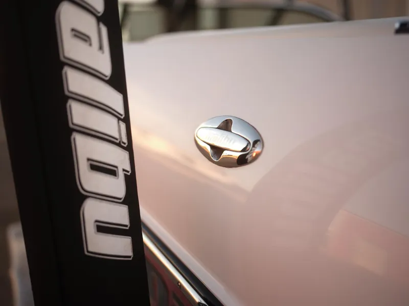 Slide: The Image of Close-up of 2003 Malibu Sunscape 21 LSV boat with logo and chrome detail. - 23