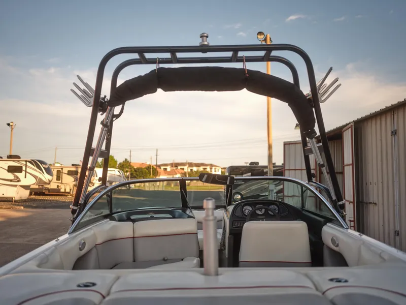 Slide: The Image of 2003 Malibu Sunscape 21 LSV boat interior with wakeboard tower in a storage area. - 25