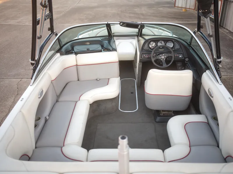 Slide: The Image of 2003 Malibu Sunscape 21 LSV boat interior with white and gray seating. - 26