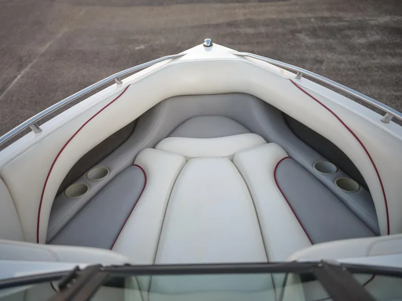 Slide: The Image of 2003 Malibu Sunscape 21 LSV boat interior with white and gray seating. - 33