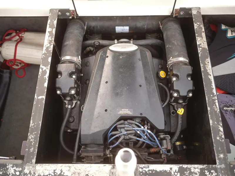 Slide: The Image of 2003 Malibu Sunscape 21 LSV boat engine compartment with visible components. - 36