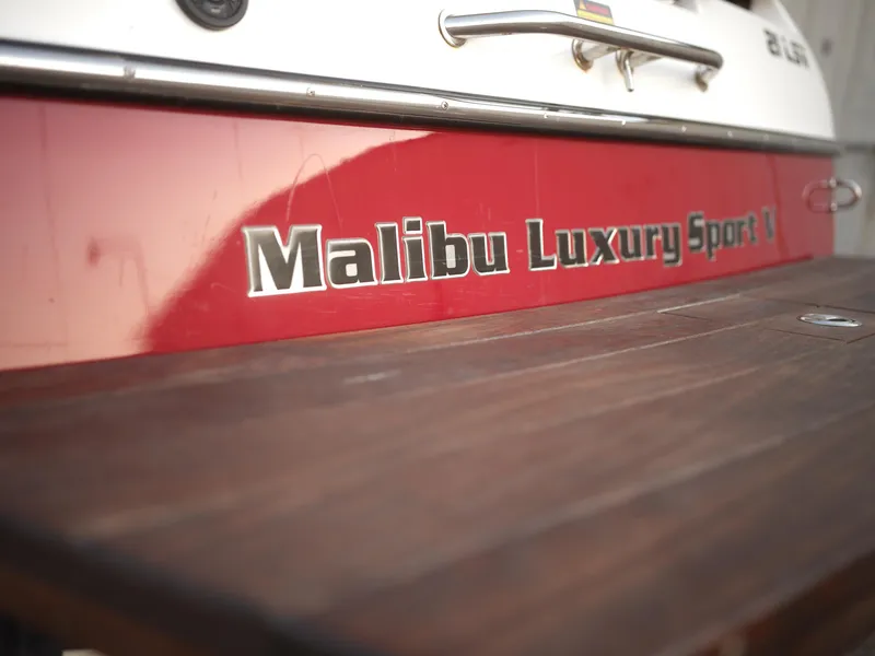 Slide: The Image of Close-up of 2003 Malibu Sunscape 21 LSV boat with Malibu Luxury Sport logo. - 39