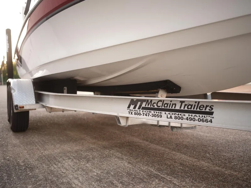 Slide: The Image of 2003 Malibu Sunscape 21 LSV boat on McClain trailer, close-up view. - 40
