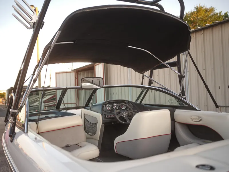 Slide: The Image of 2003 Malibu Sunscape 21 LSV boat interior with canopy and dashboard. - 41
