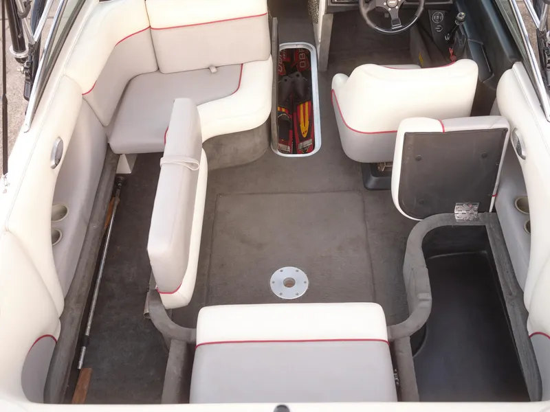Slide: The Image of Interior of a 2003 Malibu Sunscape 21 LSV boat with white and red seating. - 43