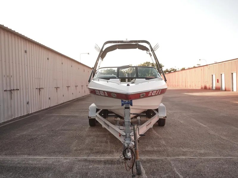 Slide: The Image of 2003 Malibu Sunscape 21 LSV boat on a trailer in a storage facility. - 5