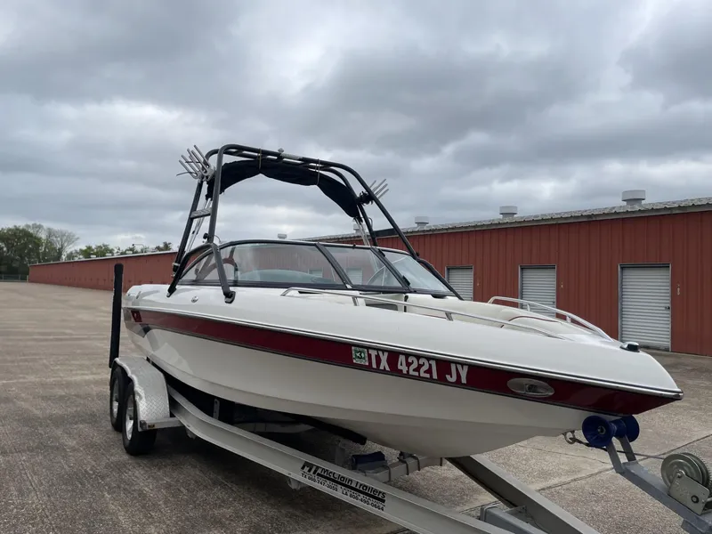 Slide: The Image of 2003 Malibu Sunscape 21 LSV boat on trailer, red and white, with wakeboard tower. - 9
