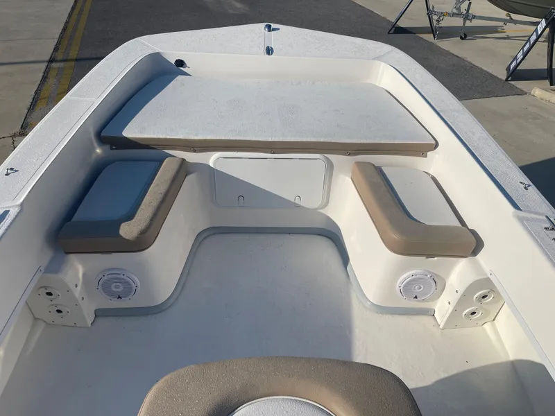 Slide: The Image of 2024 Sundance B20CCR boat interior with seating and storage compartments. - 5