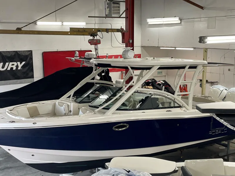 Slide: The Image of 2018 Robalo R317 Dual Console boat in a workshop. - 2