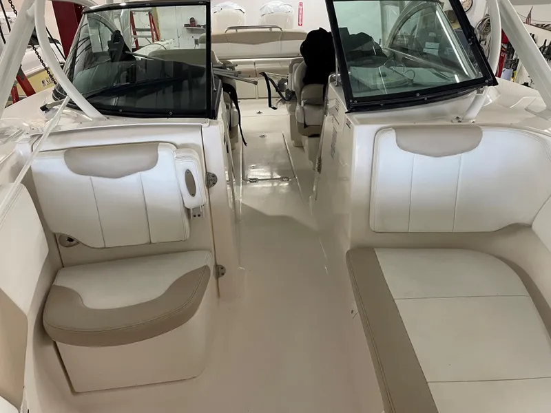 Slide: The Image of 2018 Robalo R317 Dual Console boat interior with seating and helm. - 6