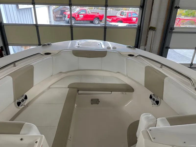 Slide: The Image of 2018 Robalo R317 Dual Console boat interior with beige and white seating. - 7