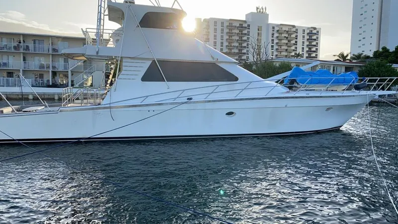 The Image of 2001 Precision Convertible yacht docked at marina with buildings in background. - 0