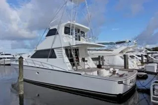 Slide: The Image of 2001 Precision Convertible yacht docked at marina under blue sky. - 1