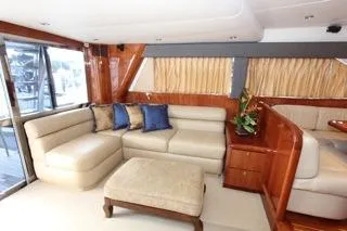 Slide: The Image of Luxurious interior of a 2001 Precision Convertible yacht with beige seating and wooden accents. - 10