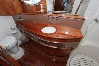 Slide: The Image of Luxurious bathroom in a 2001 Precision Convertible yacht with wooden finishes. - 16