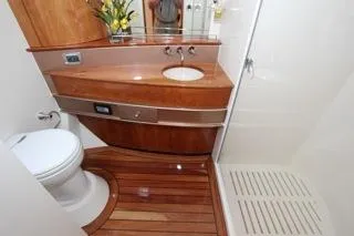 Slide: The Image of 2001 Precision Convertible yacht bathroom with wooden cabinetry and flooring. - 19