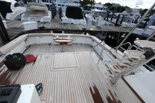 Slide: The Image of 2001 Precision Convertible yacht with spacious deck at marina. - 5