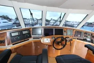 Slide: The Image of 2001 Precision Convertible yacht cockpit with advanced navigation systems and panoramic windows. - 7