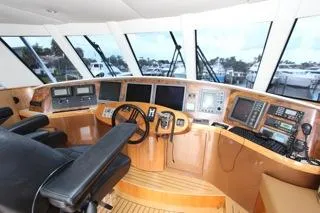 Slide: The Image of Cockpit of a 2001 Precision Convertible yacht with advanced navigation equipment. - 8