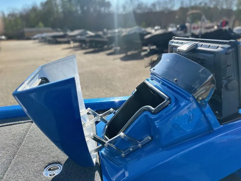 Slide: The Image of 2024 iKon LX 20 boat with open storage compartments. - 11