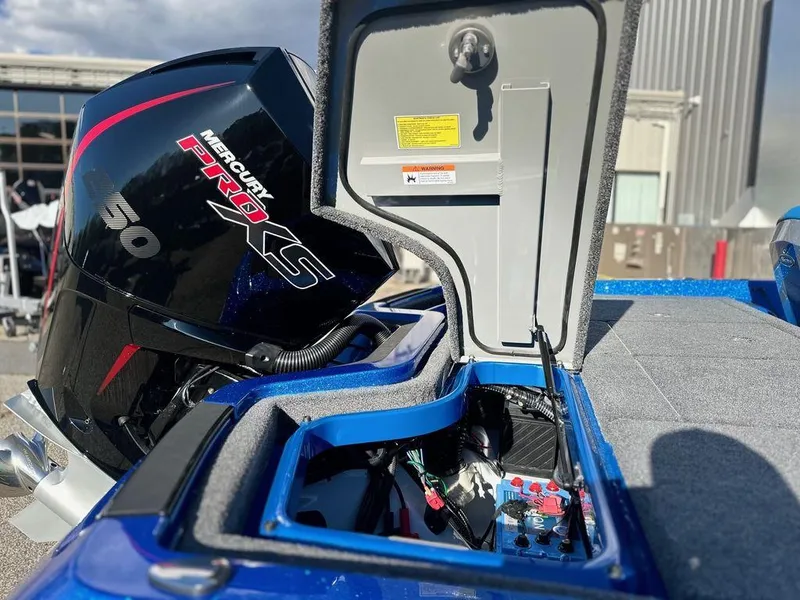 Slide: The Image of 2024 iKon LX 20 boat with Mercury Pro XS engine, open storage compartment. - 13