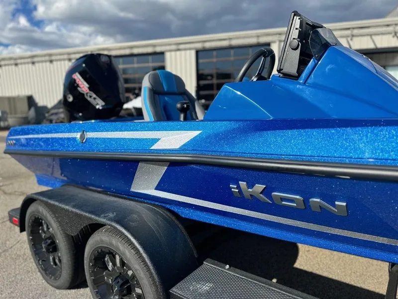 Slide: The Image of 2024 iKon LX 20 blue boat on trailer with outboard motor. - 6
