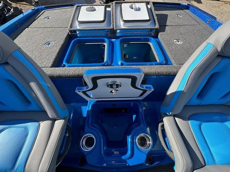 Slide: The Image of 2024 iKon LX 20 boat interior with blue and gray seating, storage compartments, and cup holders. - 8