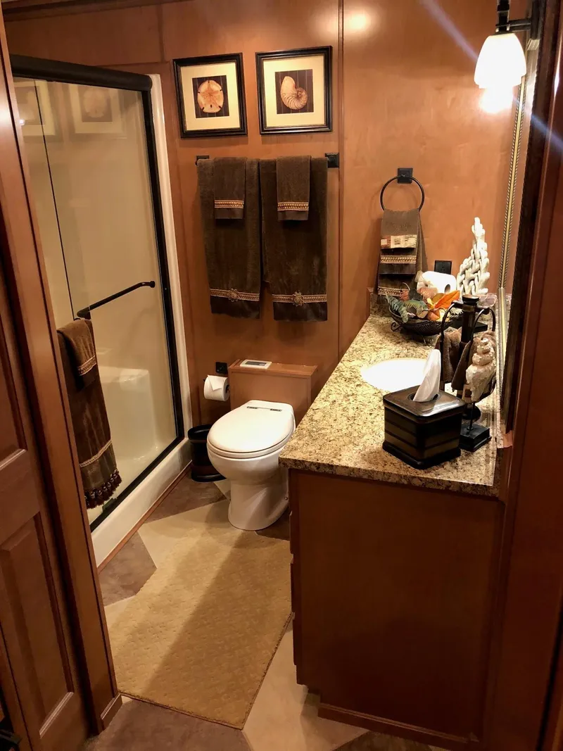 Slide: The Image of Luxurious bathroom in 2008 Sumerset Houseboat 20' x 100', featuring granite countertop and shower. - 11