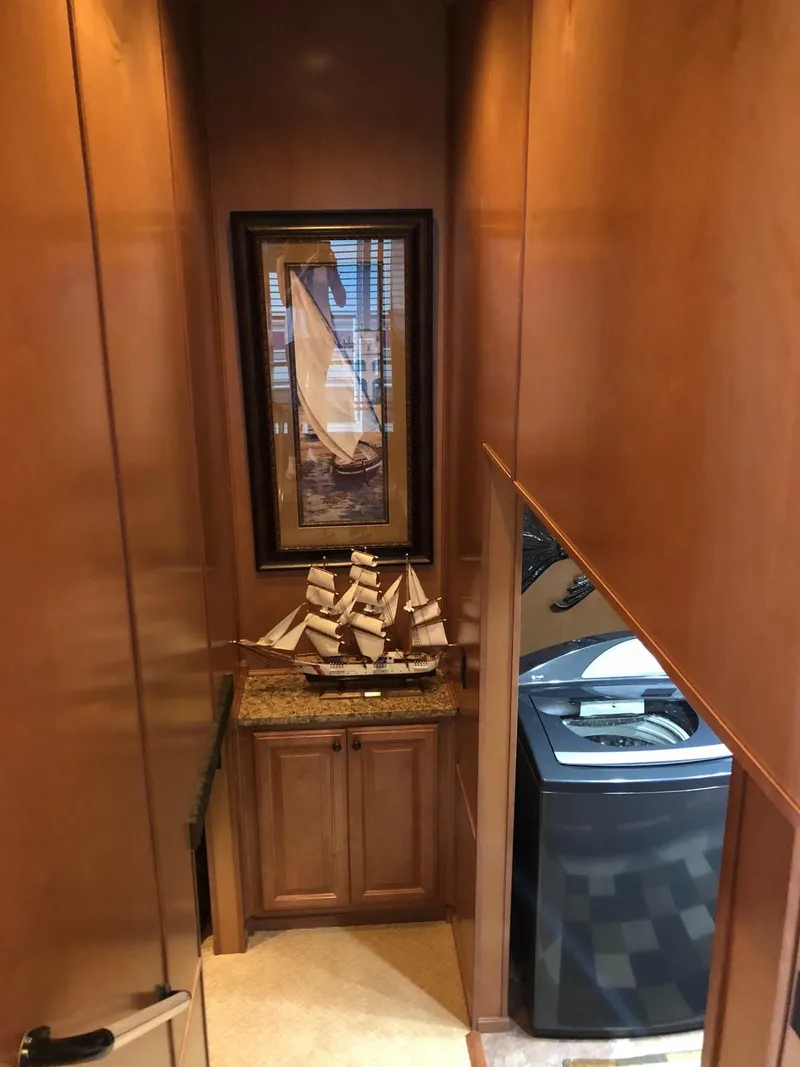 Slide: The Image of 2008 Sumerset Houseboat interior with wooden cabinetry and nautical decor. - 13