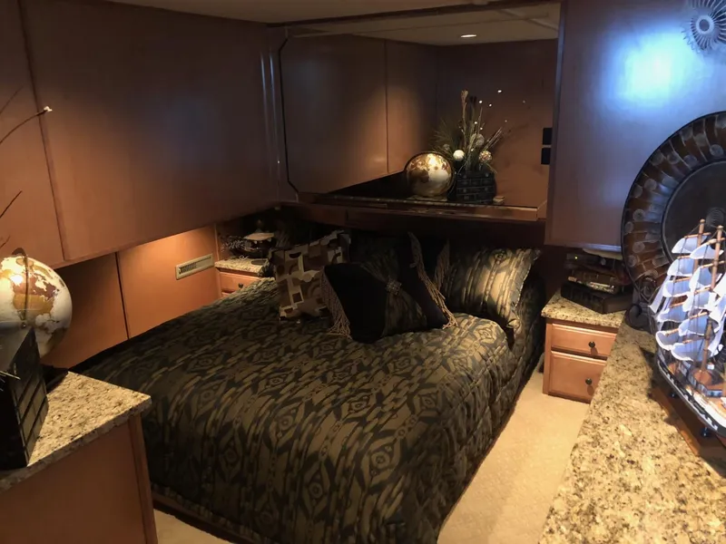 Slide: The Image of Luxurious bedroom interior of a 2008 Sumerset Houseboat 20' x 100' with elegant decor. - 19