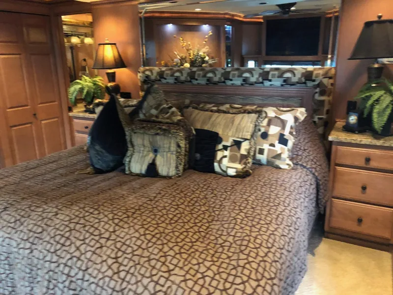 Slide: The Image of Luxurious bedroom interior of a 2008 Sumerset Houseboat 20' x 100' with elegant decor. - 21